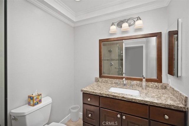 bathroom featuring crown molding, vanity, toilet, and walk in shower