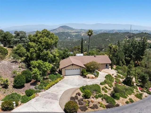 birds eye view of property with a mountain view