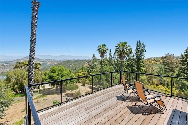 wooden terrace with a mountain view