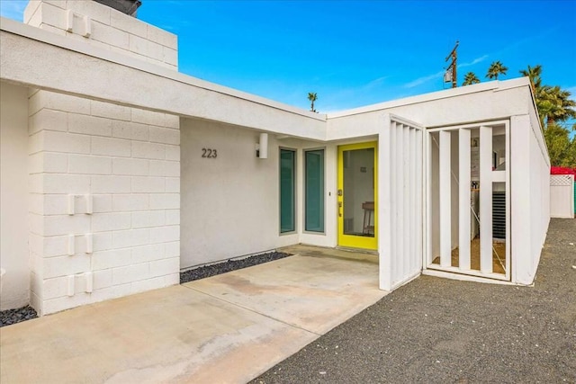 property entrance with a patio area