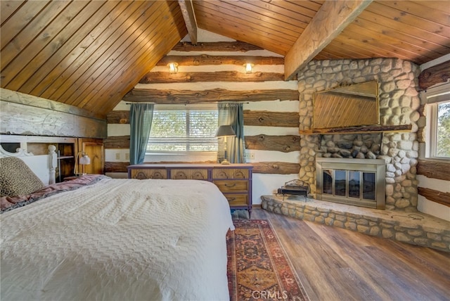 bedroom featuring hardwood / wood-style flooring, vaulted ceiling with beams, wood ceiling, and a fireplace