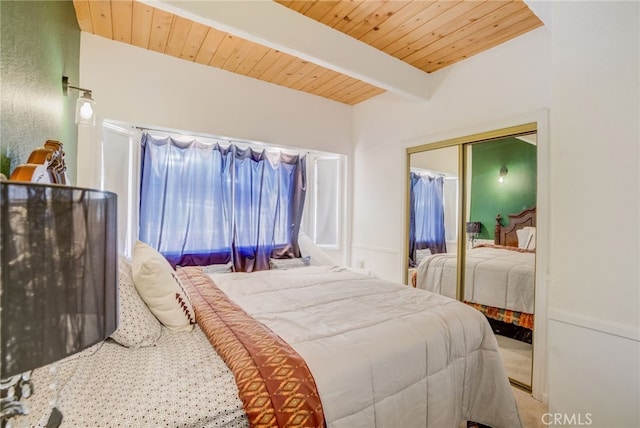 bedroom with wood ceiling, a closet, and beamed ceiling