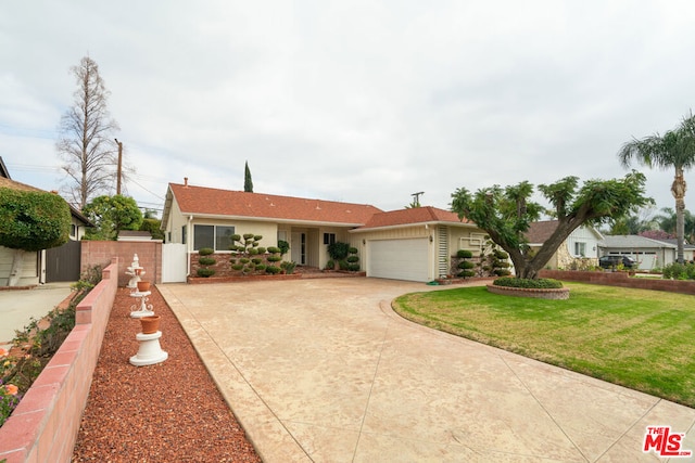 single story home featuring a garage and a front lawn