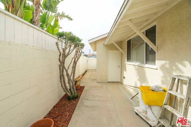 view of property exterior featuring a patio area