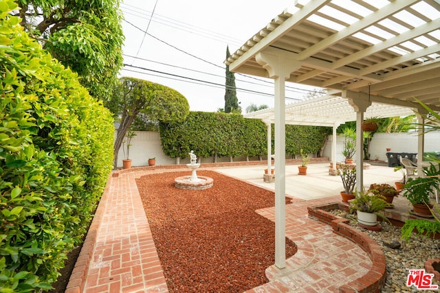 view of patio / terrace featuring a pergola