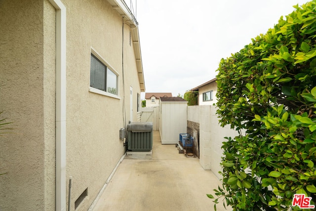 view of home's exterior featuring central AC unit and a patio