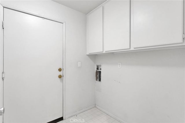 laundry area featuring hookup for a washing machine and cabinets