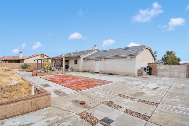 rear view of house with a patio area