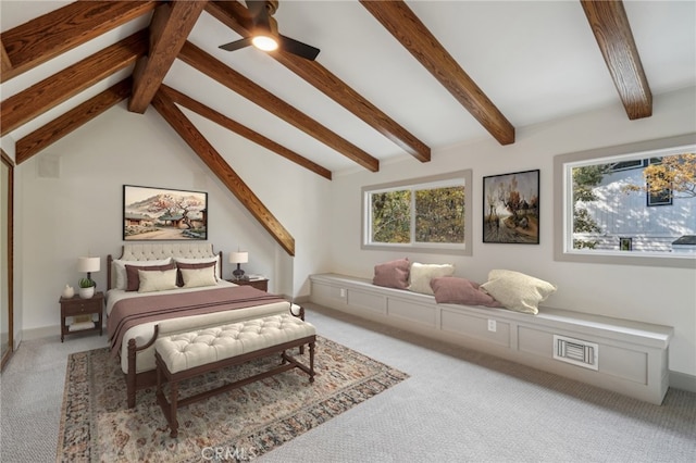 bedroom with lofted ceiling with beams and carpet