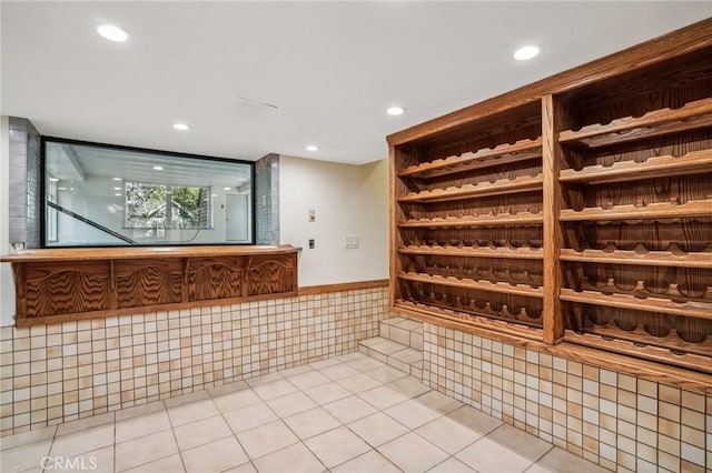 wine area featuring light tile patterned floors