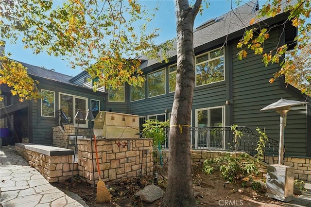 view of side of home with a sunroom