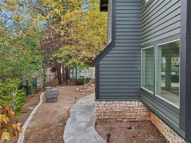 view of side of property featuring a patio area