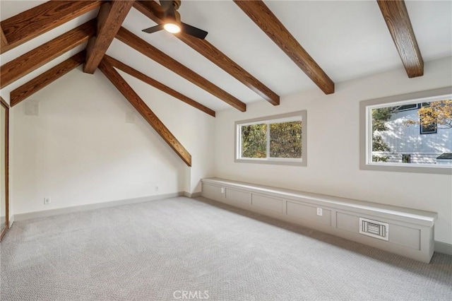 additional living space with light carpet and vaulted ceiling with beams