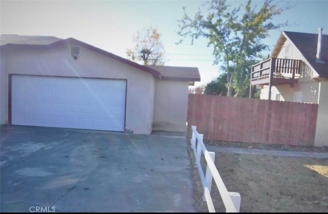 view of side of property with a garage