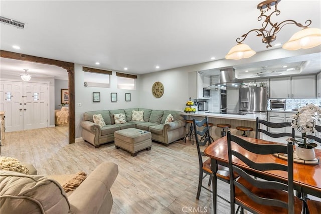 living room with light hardwood / wood-style flooring