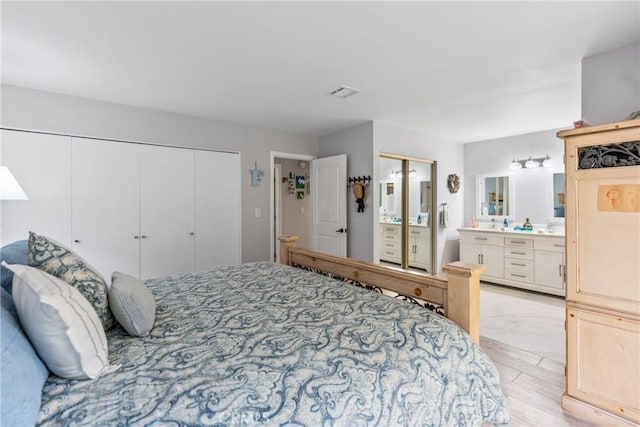 bedroom featuring a closet and ensuite bathroom