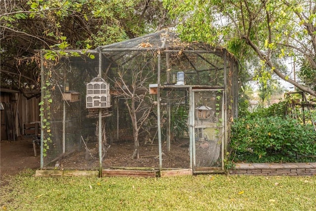 view of outbuilding with a yard