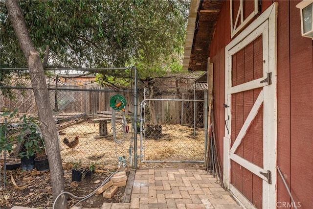 view of gate with an outdoor structure