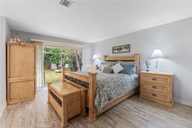 bedroom with light hardwood / wood-style flooring