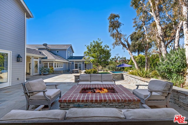 view of patio featuring a fire pit