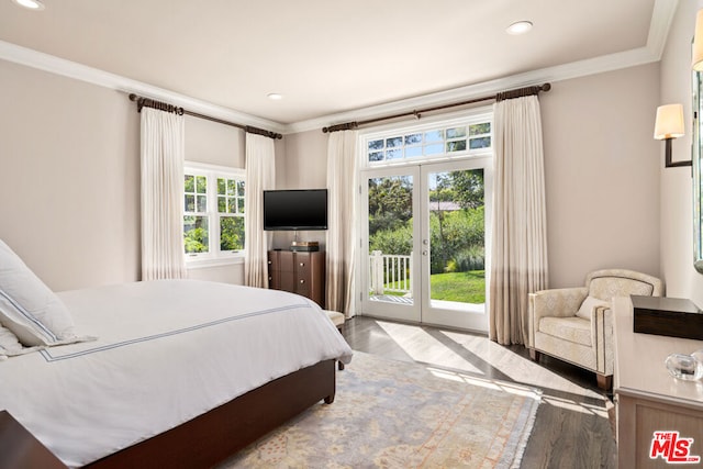 bedroom with crown molding, access to exterior, and light hardwood / wood-style floors