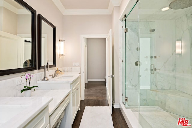 bathroom featuring vanity, hardwood / wood-style floors, an enclosed shower, and crown molding