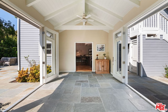 interior space with ceiling fan