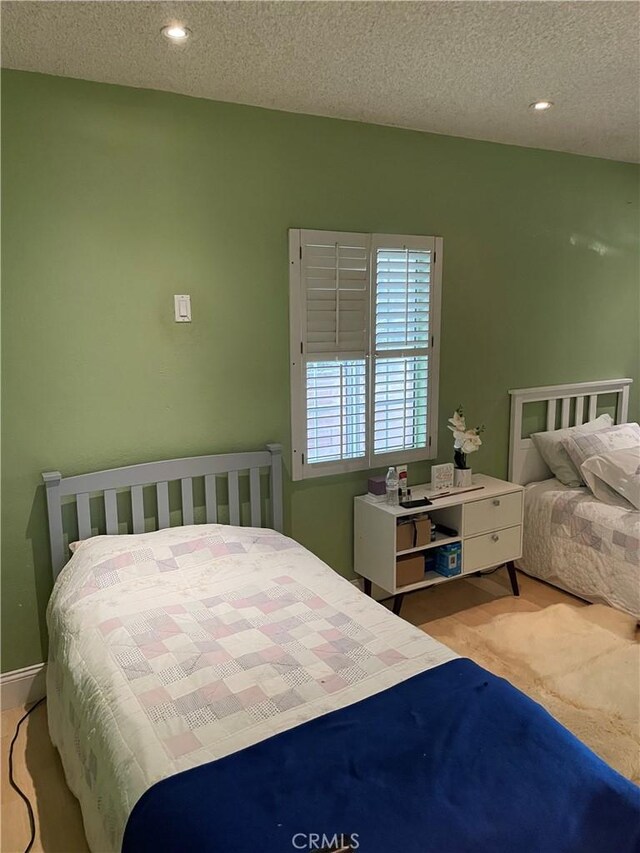 bedroom with a textured ceiling