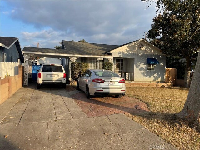 single story home with a carport