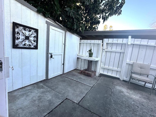 view of patio / terrace with a storage unit