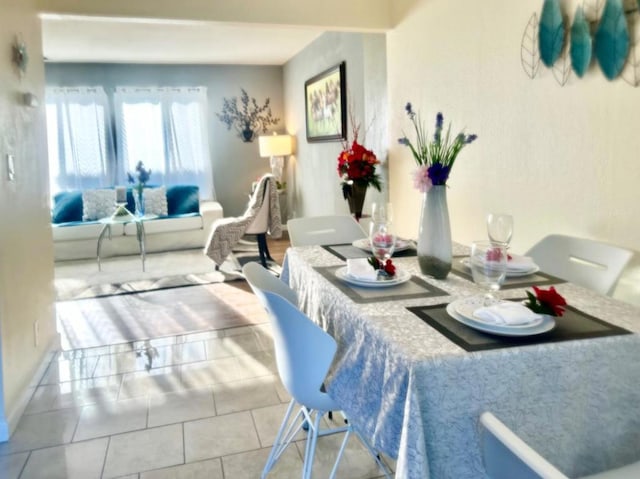 dining area featuring tile patterned floors