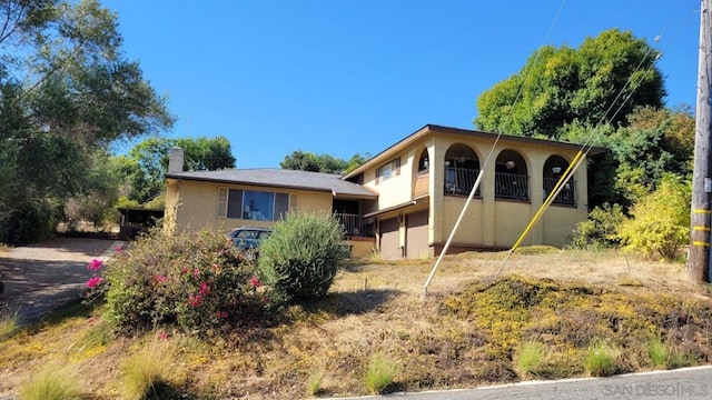 view of front of property with a balcony