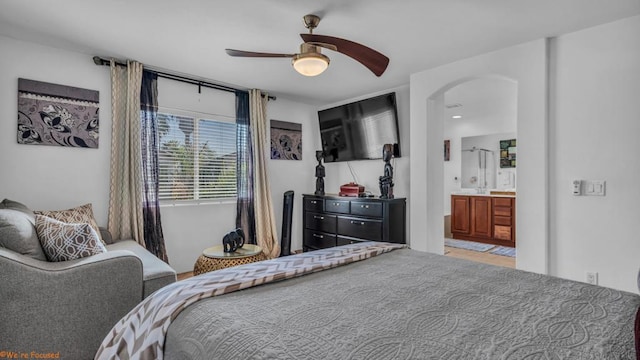 bedroom featuring ensuite bath and ceiling fan