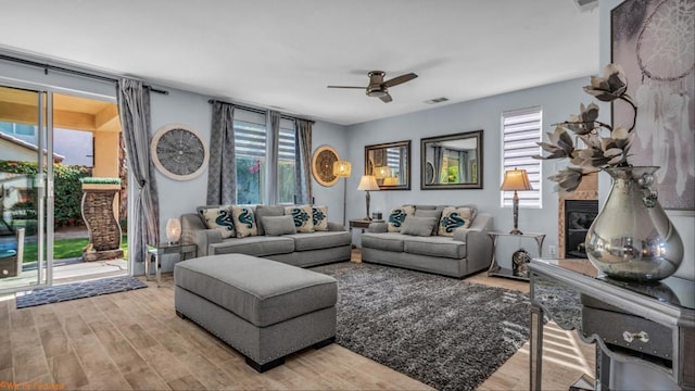 living room featuring hardwood / wood-style flooring and ceiling fan