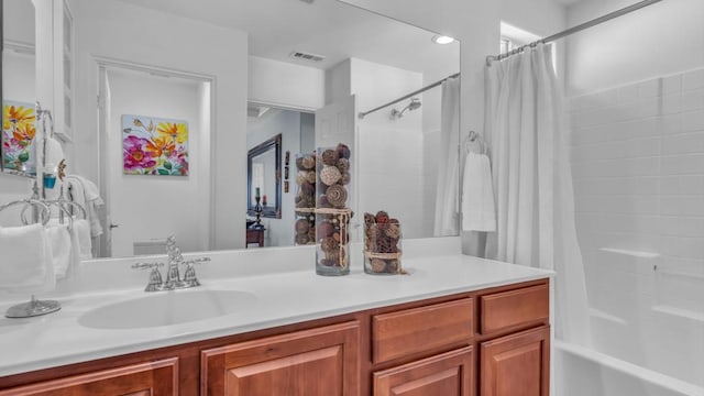 bathroom featuring vanity and shower / bath combo with shower curtain