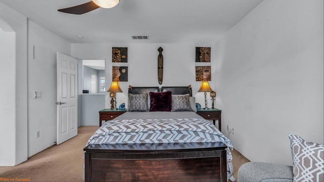 bedroom featuring ceiling fan and light colored carpet