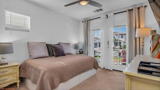 bedroom featuring ceiling fan, light colored carpet, and access to outside