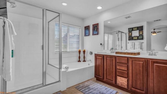 bathroom with vanity, tile patterned flooring, shower with separate bathtub, and ceiling fan