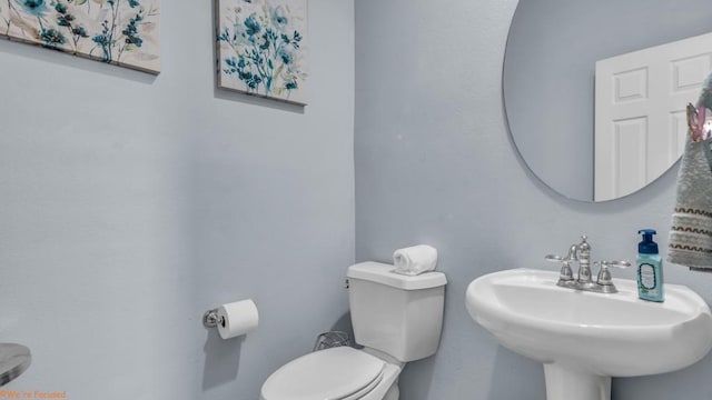 bathroom with toilet and sink