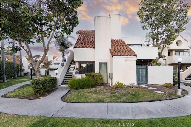 view of front of home with a lawn