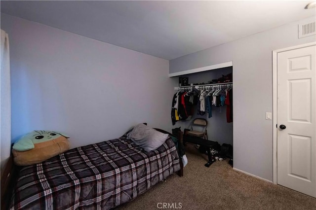 carpeted bedroom with a closet