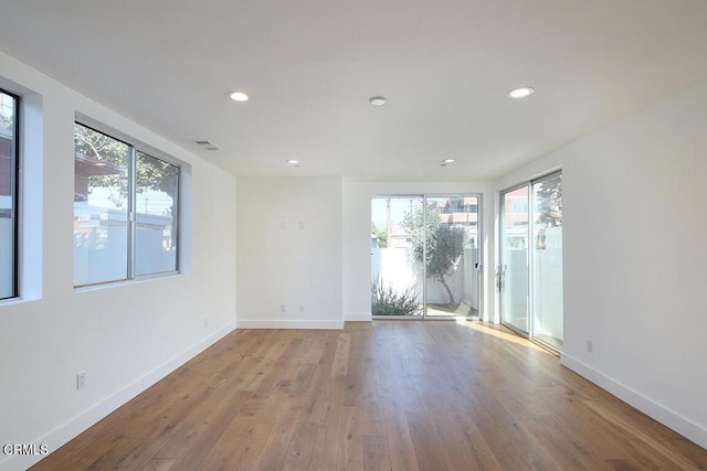 spare room with light hardwood / wood-style floors