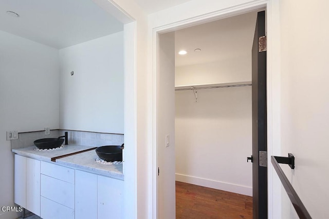 bathroom with hardwood / wood-style floors