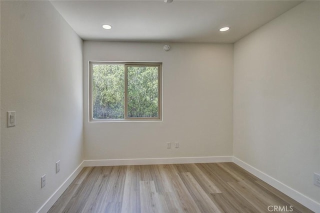 unfurnished room featuring light wood-type flooring