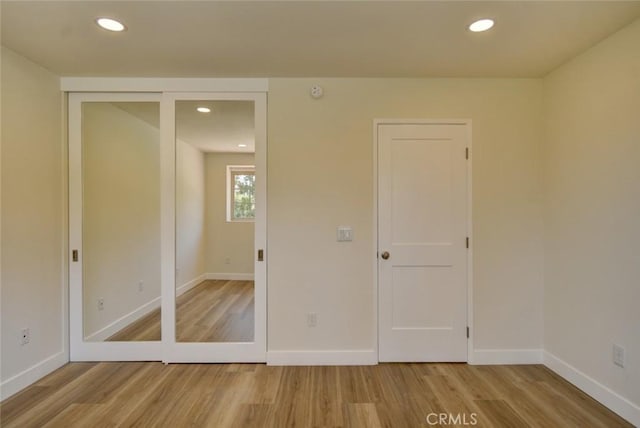 unfurnished bedroom featuring light hardwood / wood-style floors