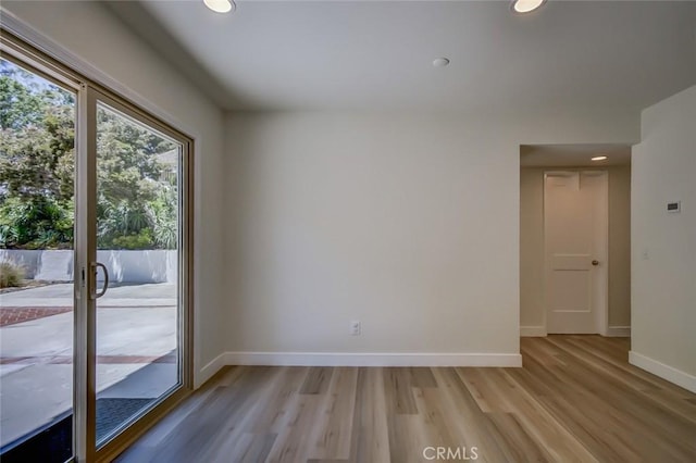 spare room featuring light wood-type flooring