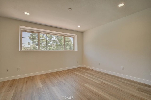 unfurnished room featuring light hardwood / wood-style flooring