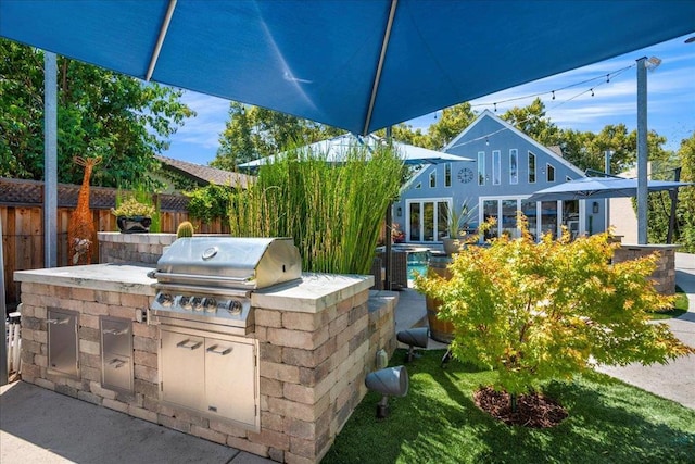 view of patio / terrace featuring area for grilling and exterior kitchen