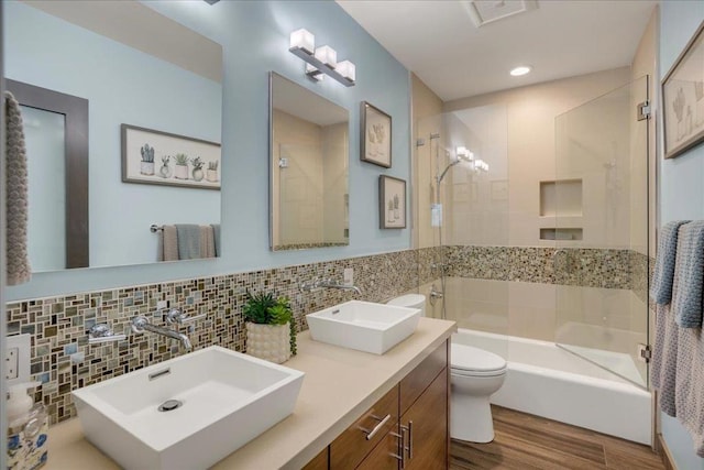 full bathroom with vanity, backsplash, hardwood / wood-style flooring, and toilet