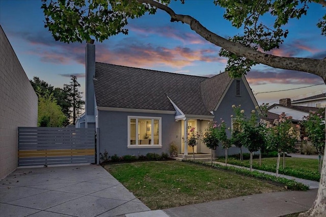 view of front of property with a lawn